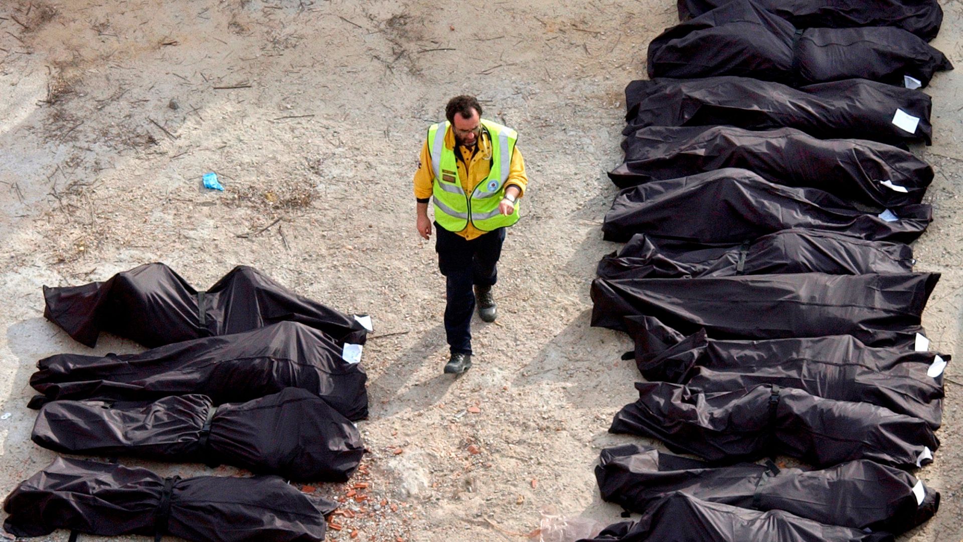  ** FILE ** A Spanish rescue worker counts the bodies removed from one of the commuter trains following a number of explosions on trains in Madrid in this March 11, 2004, file photo. The first four of 28 defendants in the 2004 Madrid train bombings were found guilty of murder and other charges Wednesday, Oct. 31, 2007, in the culmination of a politically divisive trial over Europe's worst Islamic terror attack. The backpack bomb attacks killed 191 people and wounded more than 1,800. (AP Photo/Peter DeJong)