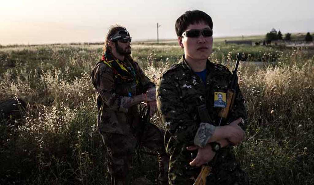 Two foreign fighters who joined the YPG in Syria at the furniral of the Spanish citizen Rull Linhoff who is buried in Dayrik / Syria on the Matyr Khabat cemetery. Mr. Linhoff had fought with the YPG in Deir es-Zor and was killed there. (Photo by Sebastian Backhaus/NurPhoto/Sipa USA)