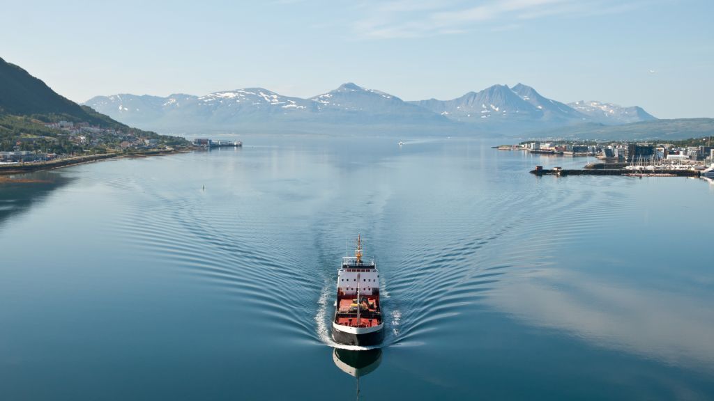 Ship in Tromsö, Norway, with panorama view to mountains in the background