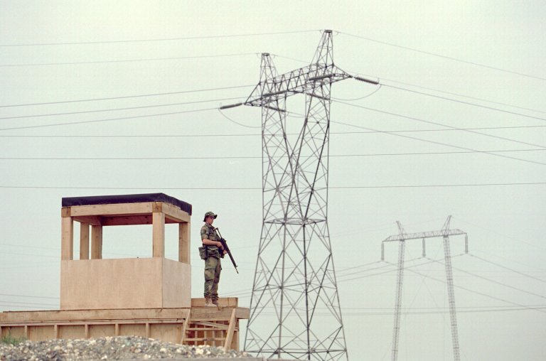 Soldier guarding a gate