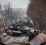 People look at the gutted remains of Russian military vehicles on a road in the town of Bucha, close to the capital Kyiv, Ukraine, Tuesday, March 1, 2022