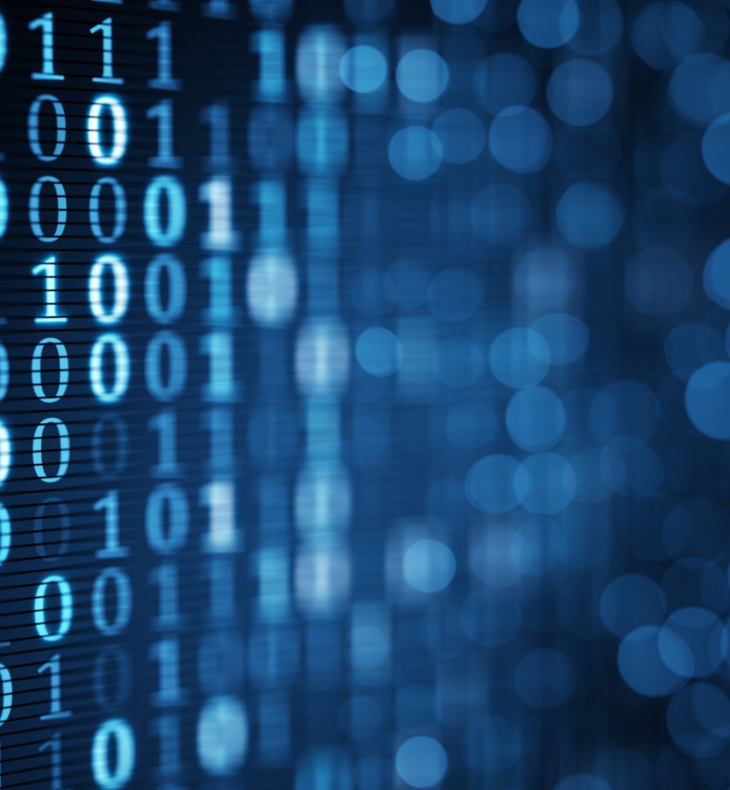 blue digital binary data on computer screen. Close-up shallow DOF