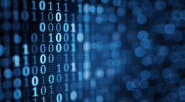 blue digital binary data on computer screen. Close-up shallow DOF